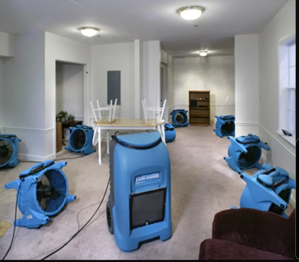 Air movers and dehumidifier setup for Water Damage Restoration in August